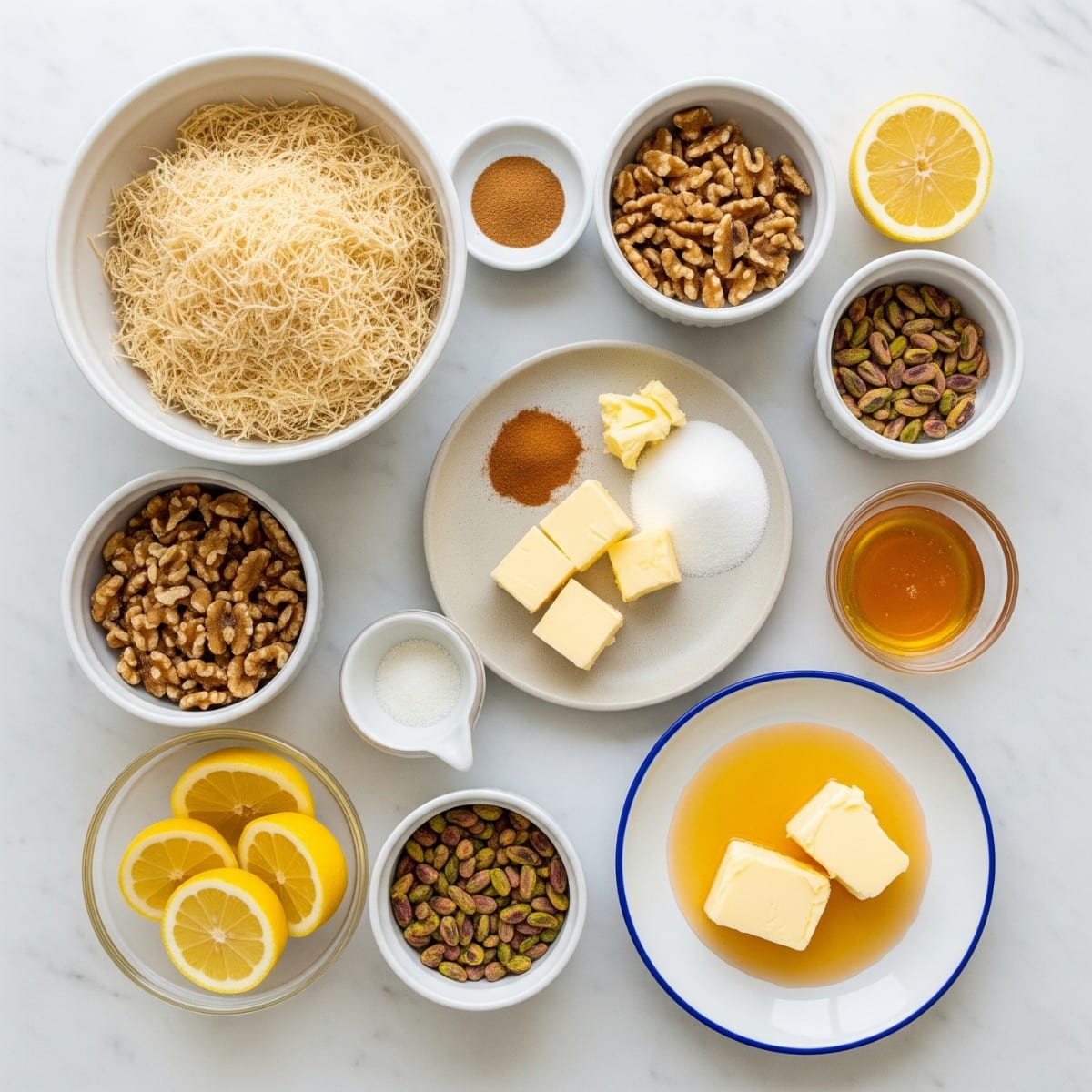 Bowls with kataifi shredded pastry, chopped nuts, butter, cinnamon, sugar, and lemon arranged for Greek desserts kataifi preparation