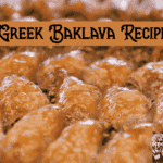 Freshly baked Greek baklava in a tray, cut into diamond shapes with golden filo layers