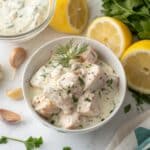 Greek chicken marinade with yogurt, showcasing creamy yogurt, garlic, and Mediterranean herbs